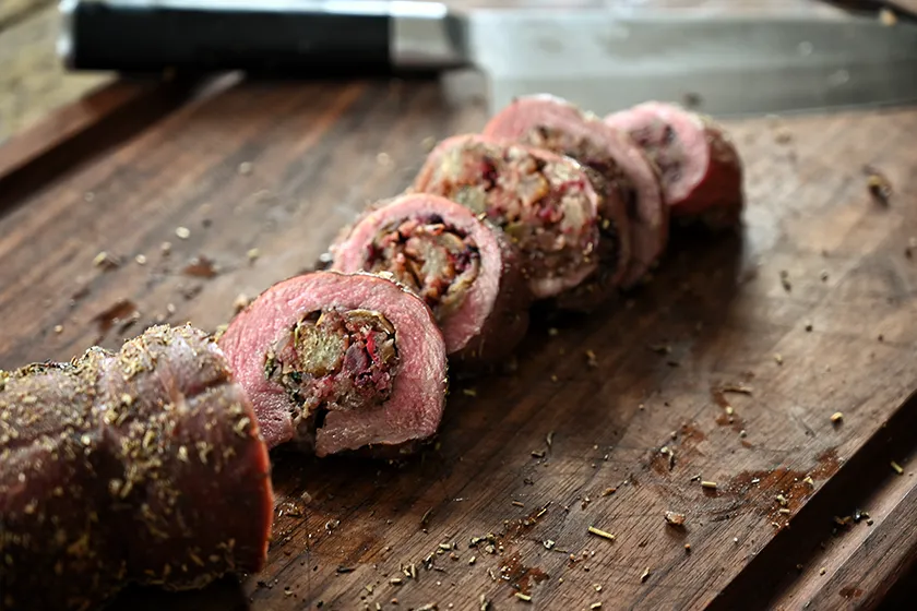 venison roulade on cutting board