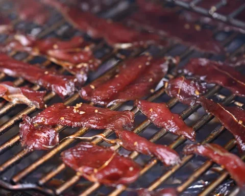 deer jerky drying on a rack