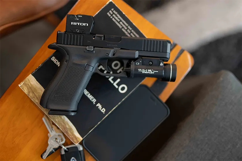 a conceal carry pistol on a book in a home