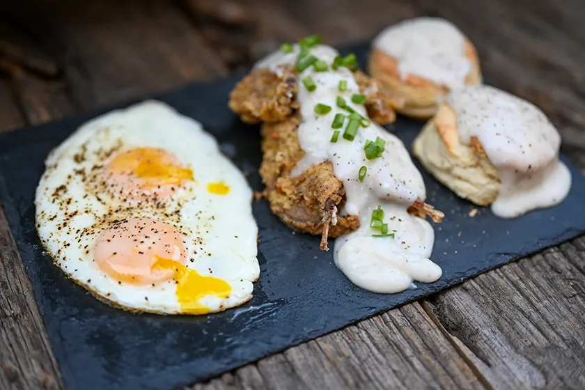 spatchcocked dove with eggs and biscuits and gravy